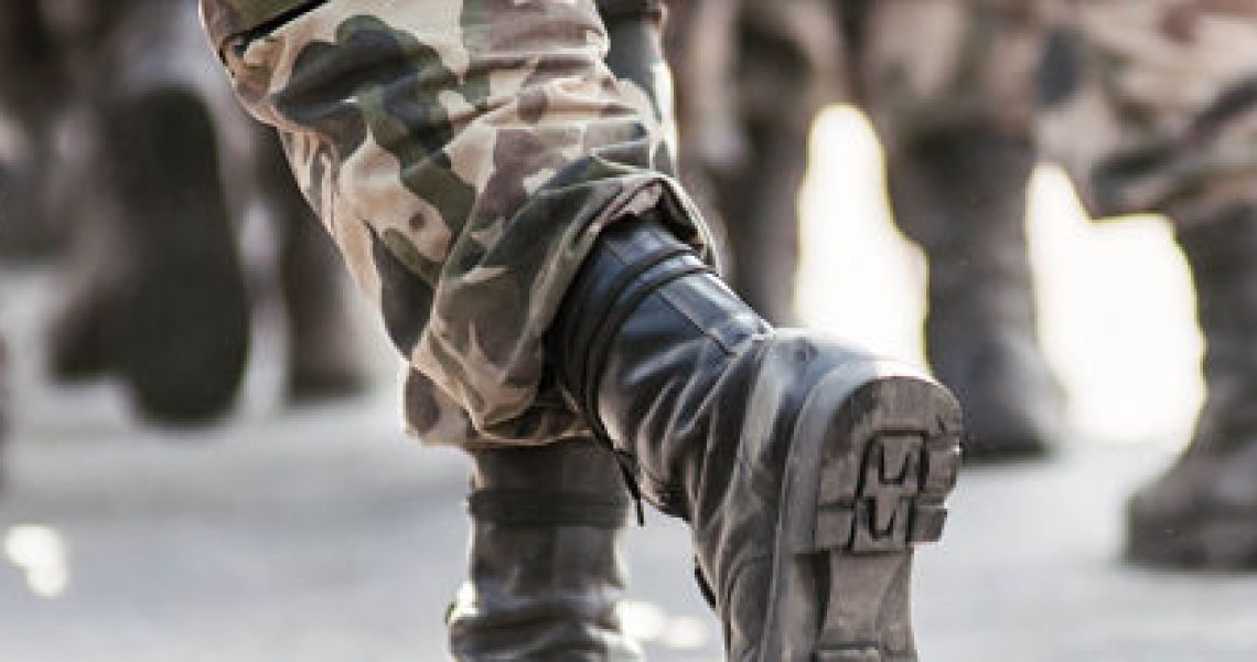 running soldiers carrying weapons