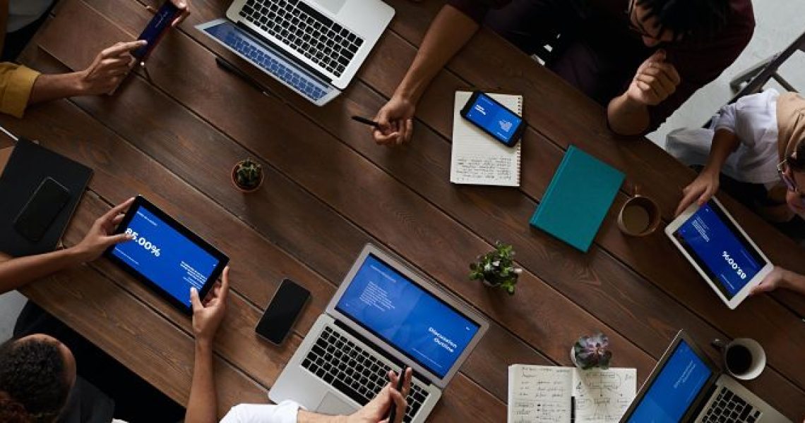 photo-of-people-leaning-on-wooden-table-3183183_opt